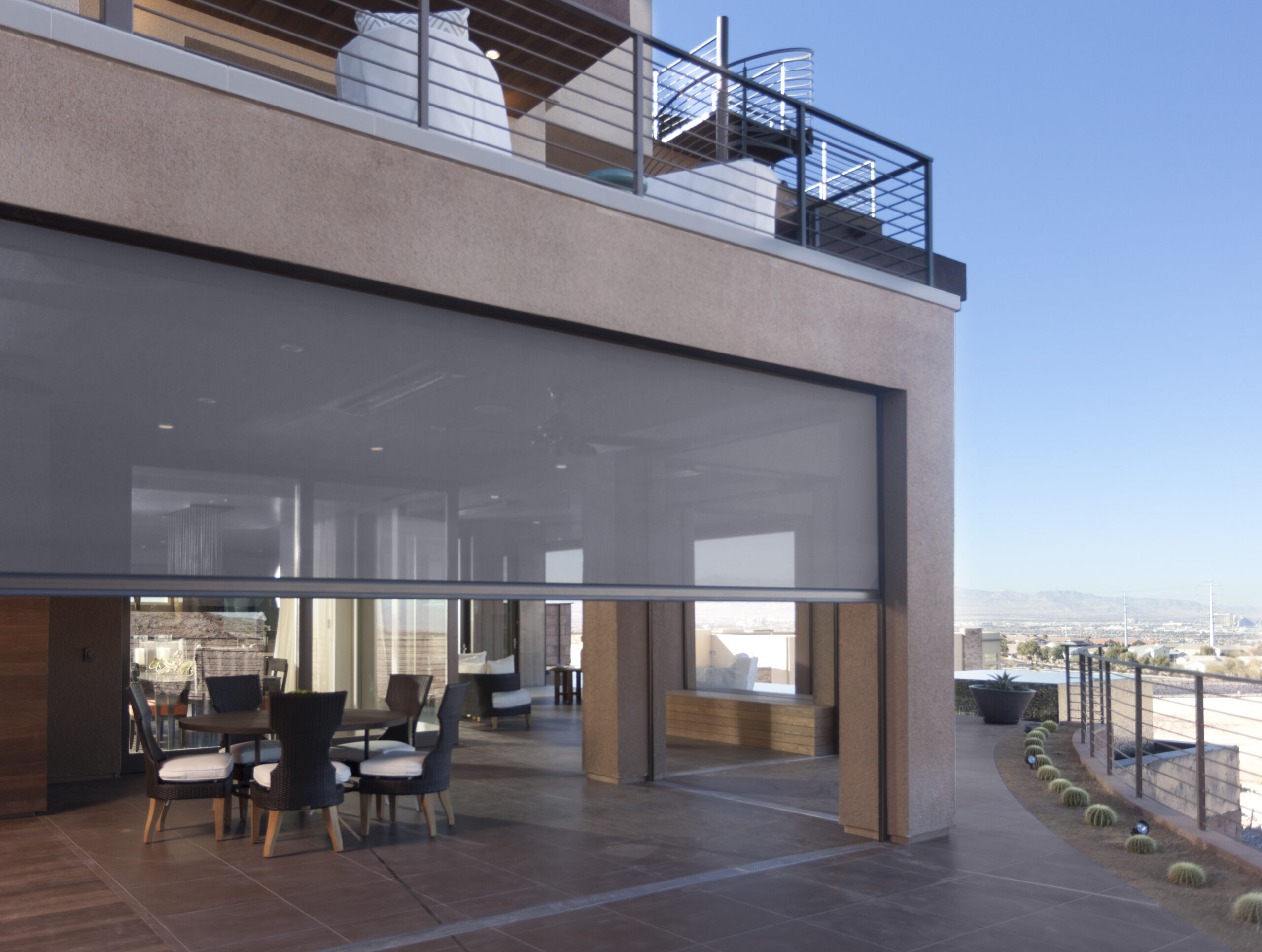Phantom motorized retractable screens installed on a balcony of a gorgeous home