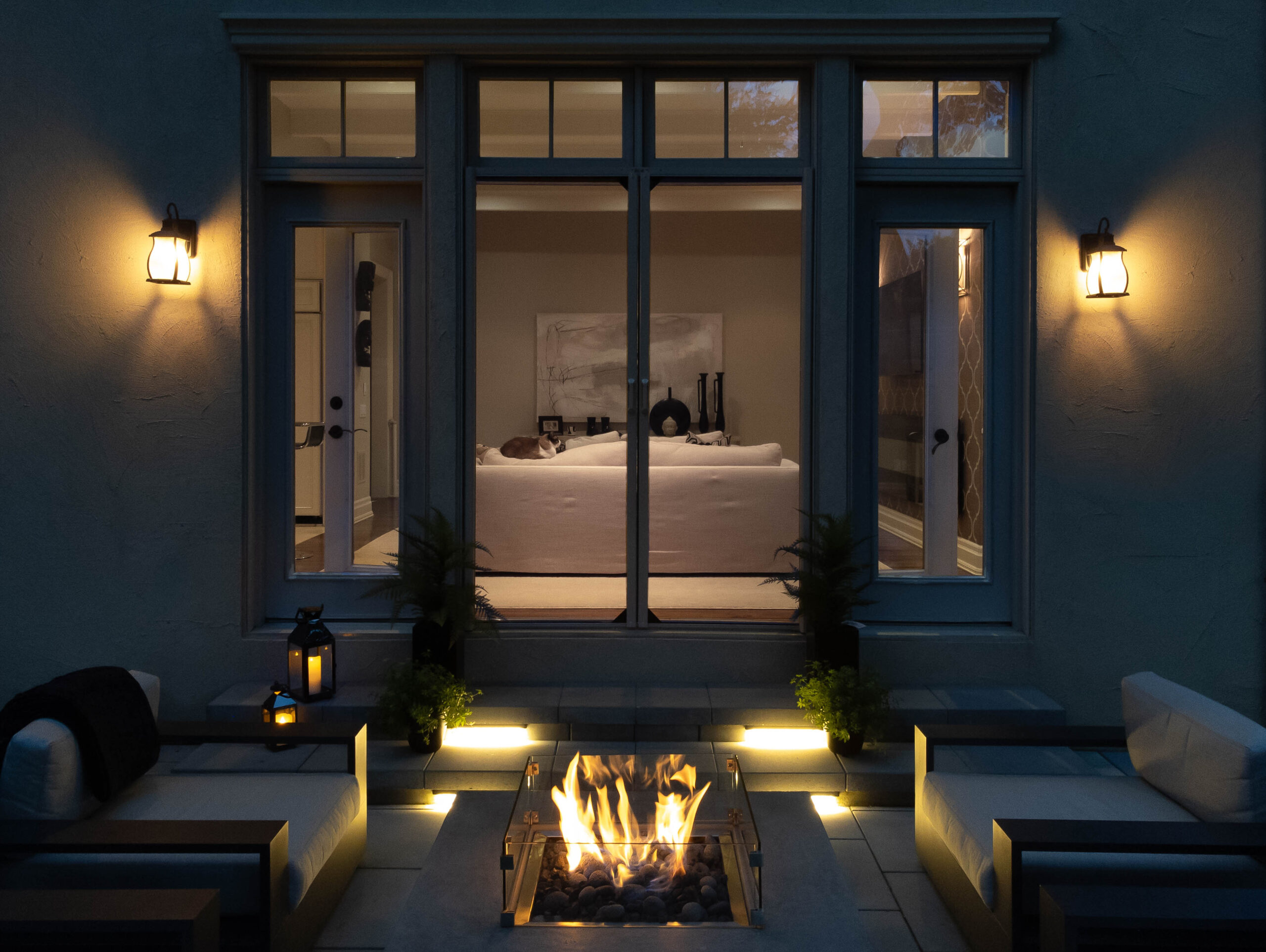 A double french door with Phantom Screens in the night, transitioning the indoor and outdoor spaces beautifully.